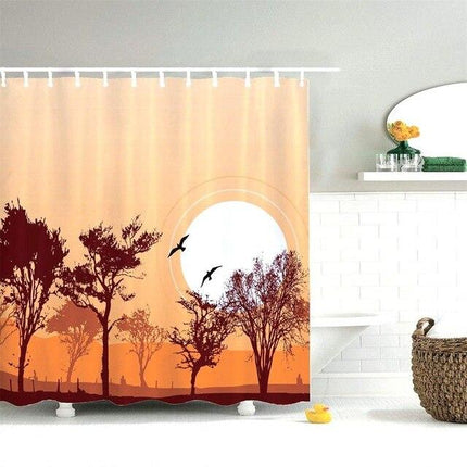 Oranssi suihkuverho auringonlaskun maisemalla