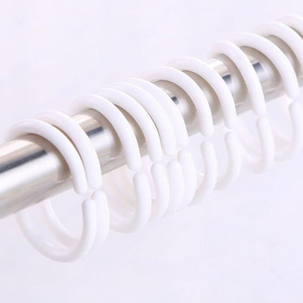 Läpinäkyvä suihkuverho kimaltelevalla kuviolla