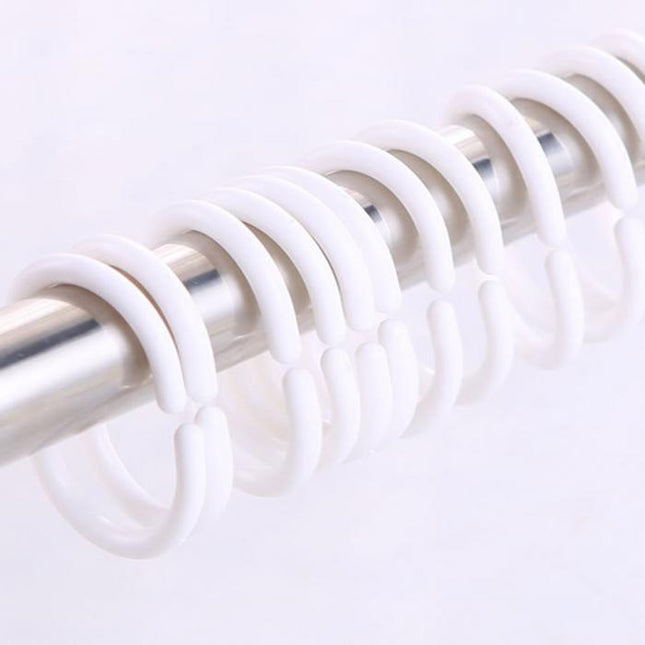 Läpinäkyvä suihkuverho kimaltelevalla kuviolla